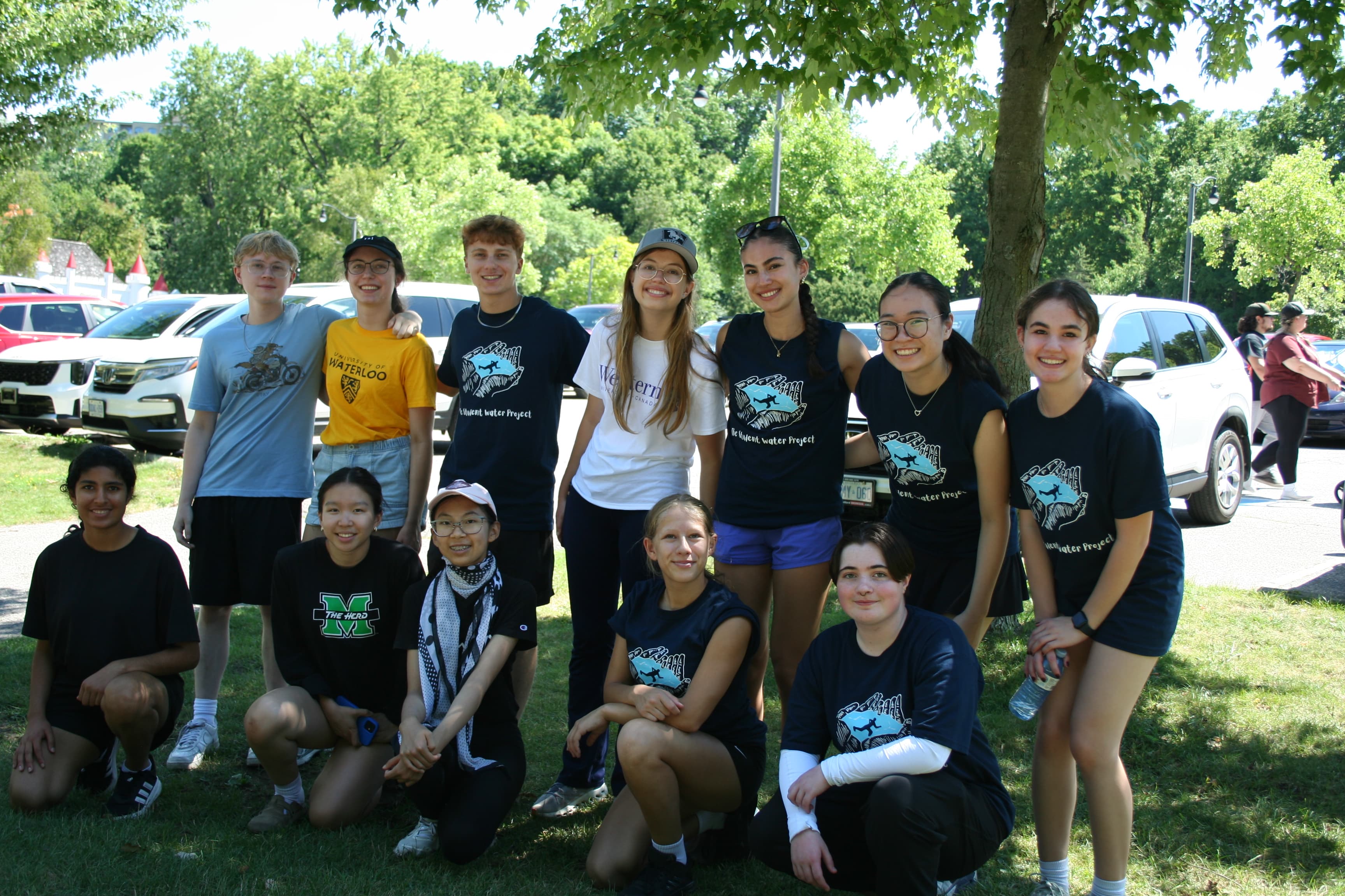 Student Water Project volunteers posing together in a park